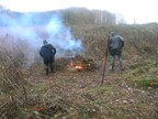 Nigel and Jacky of Norfolk Conservation Corps tending the brash fire at Pensthorpe (4518)